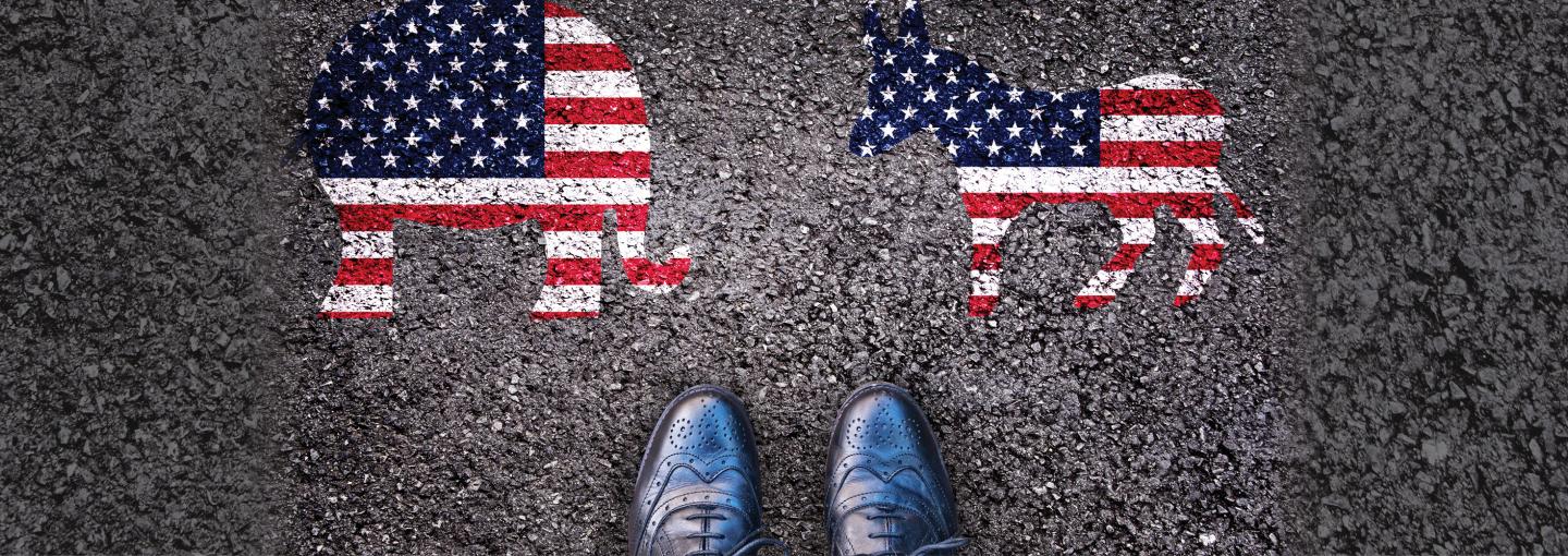 Swing Voters Image - painting of GOP and Democratic symbols, with person's shoes between them