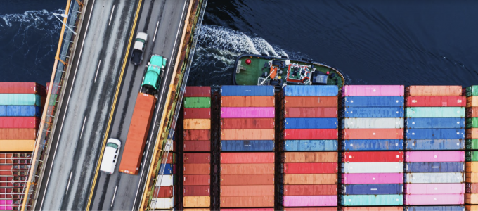 Image - shipping freighter passing underneath a bridge
